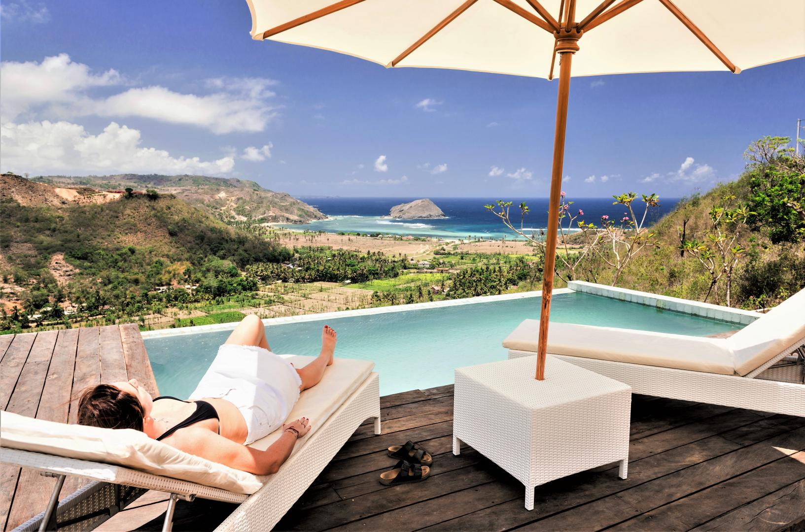 Relaxing next to the pool at Villa Atas Pelangi
