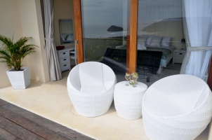 Seats with a refreshing drink in front of the master bedroom